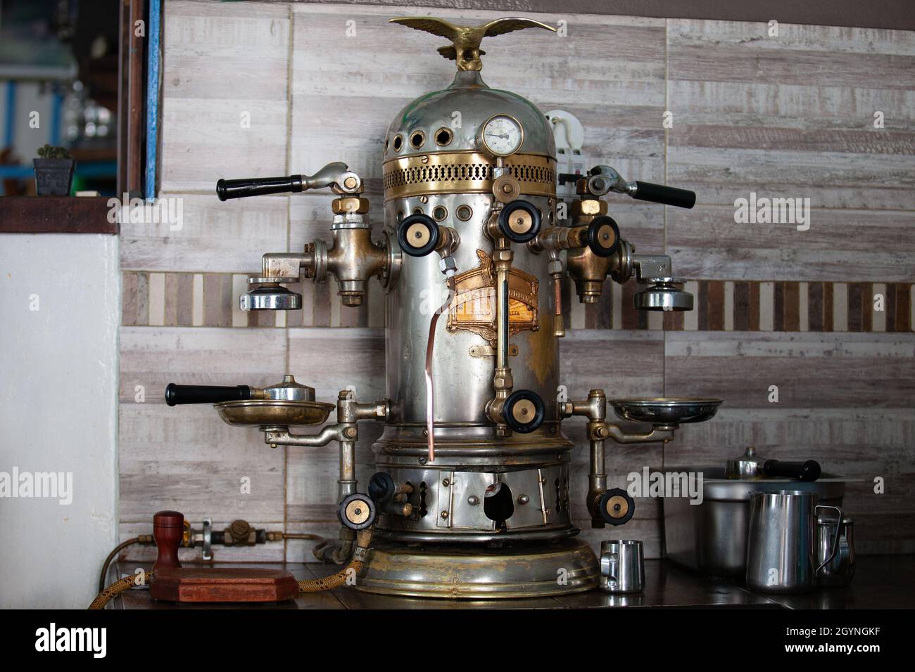 https://c8.alamy.com/comp/2GYNGKF/salento-colombia-july-2021-the-victoria-arduino-oldest-coffee-maker-on-town-built-in-1905-at-the-famous-cafe-de-la-esquina-in-the-small-city-of-2GYNGKF.jpg