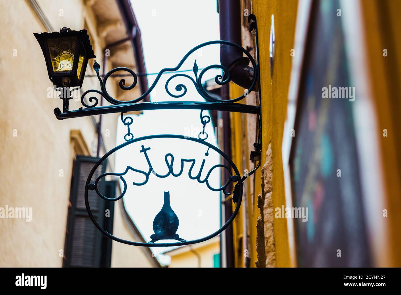 Verona, Italy - October 1, 2021: Street sign for a traditional Italian osteria where you can taste local wines. Stock Photo