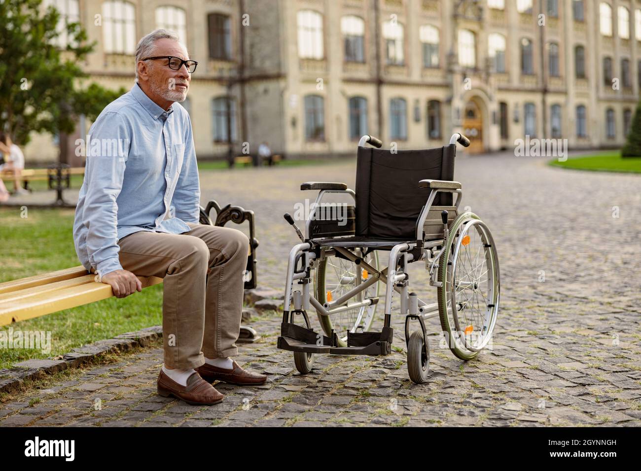 Male in wheelchair thinking hi-res stock photography and images - Alamy