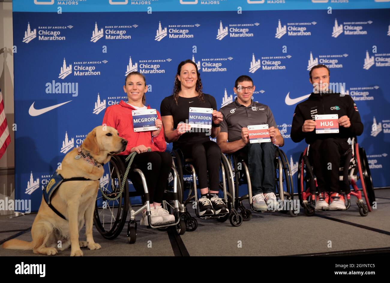 Chicago, Illinois, USA. 8th Oct, 2021. Bank of America Chicago Marathon Elite wheelchair athletes (left) AMANDA MCGRORY (United States) with her service dog, TATYANA MCFADDEN (United States), DANIEL ROMANCHUK (United States), and MARCEL HUG (Switzerland) hold their racing bibs Friday October 8, 2021 after a press conference at the Hilton Chicago. (Credit Image: © Pat A. Robinson/ZUMA Press Wire) Credit: ZUMA Press, Inc./Alamy Live News Stock Photo