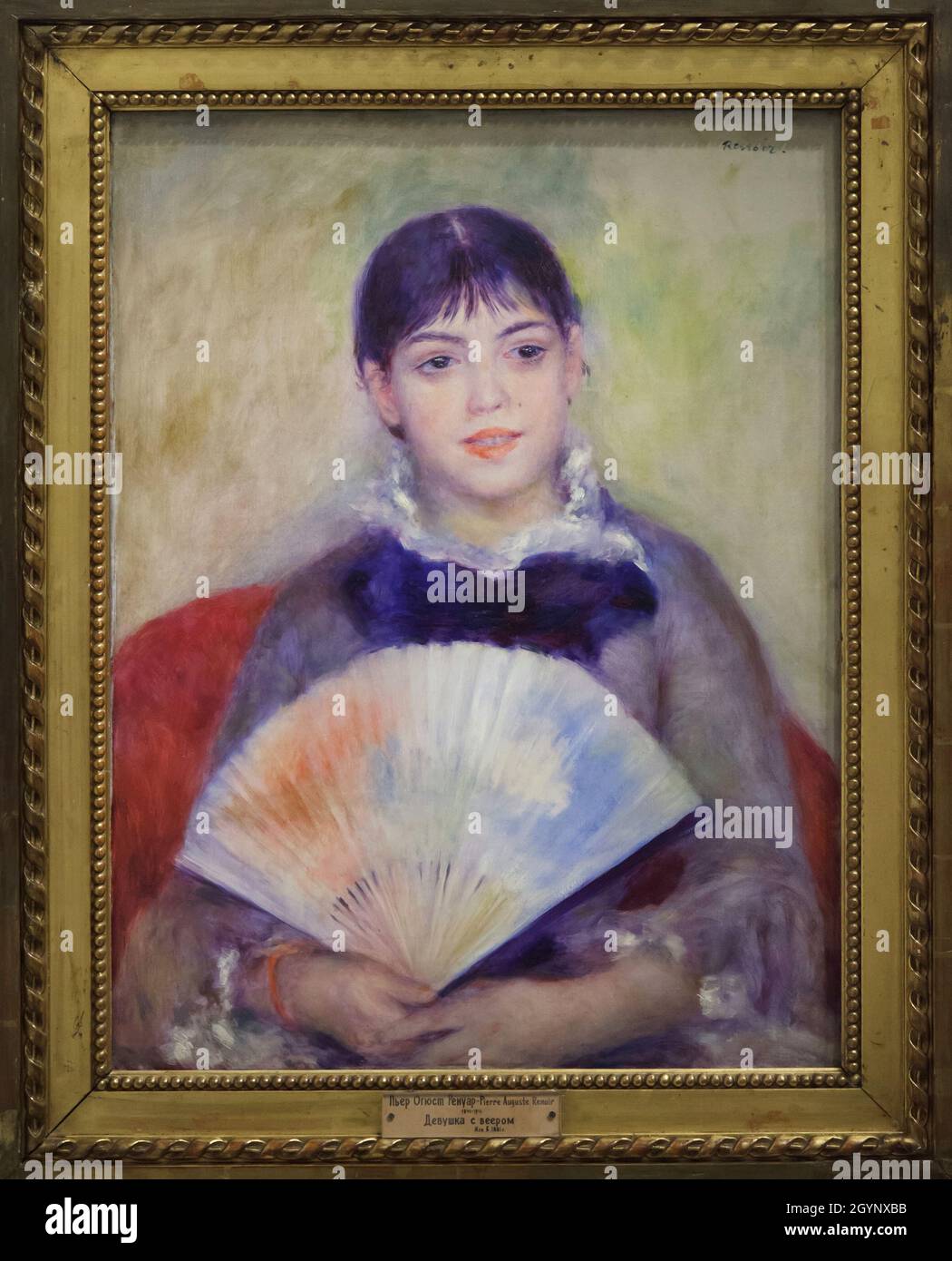 Painting 'Young Woman with a Fan' by French Impressionist painter Pierre-Auguste Renoir (1880) on display at the exhibition 'Icons of Modern Art from the Morozov Collection' in the Fondation Louis Vuitton in Paris, France. The exhibition runs till 22 February 2022. Stock Photo