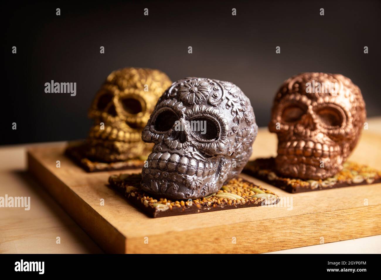 edible ornamented mexican skull made of chocolate gourmet, traditional gift for 'dia de muertos' day of the death in Mexico culture named 'calaverita Stock Photo