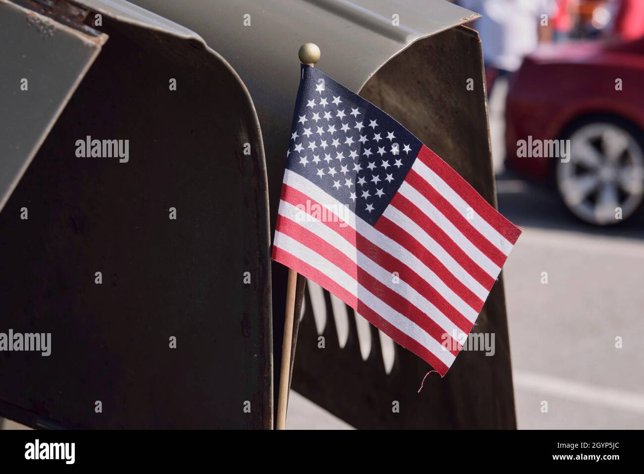 A small U.S.A. flag flies on a custom car hood at the 2021 Endless Summer Cruisin in Ocean City Maryland. Stock Photo