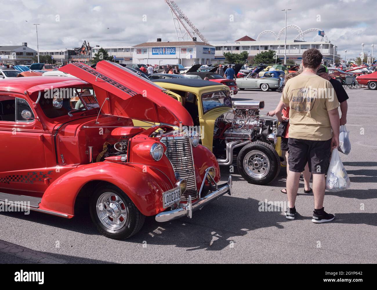 Visitors look at a wide variety of hot rods and custom cars at the 2021 Endless Summer Cruisin in Ocean City Maryland. Stock Photo