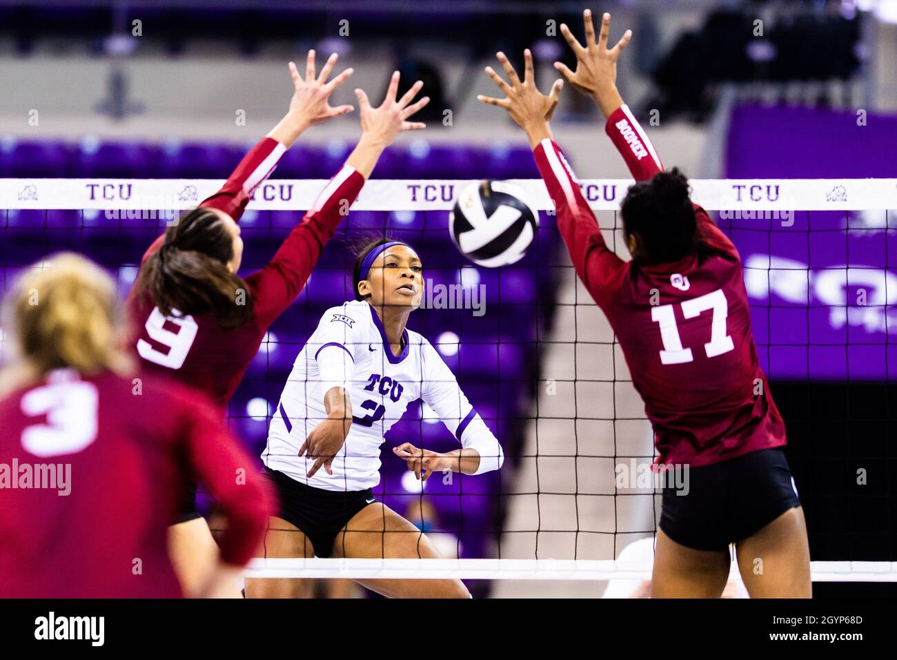 Fort Worth, Texas, USA. 8th Oct, 2021. MYKAYLA MYERS (3) hits past SAVANNAH DAVISON (9) and TYLER ALCORN (17) winning the final point of set 1 during a BIG 12 conference match between TCU and OU at the Ed and Rae Schollmaier Arena in Ft. Worth Texas, on October 08, 2021. Oklahoma went on to win the match 3:2 with a reverse sweep. (Credit Image: © Matthew Smith/ZUMA Press Wire) Credit: ZUMA Press, Inc./Alamy Live News Stock Photo