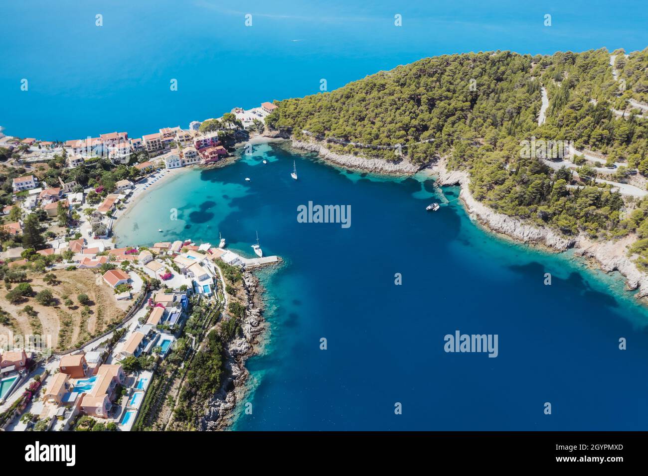 Assos picturesque fishing village from above, Kefalonia, Greece. erial drone  view. Sailing boats moored in turquoise bay Stock Photo - Alamy