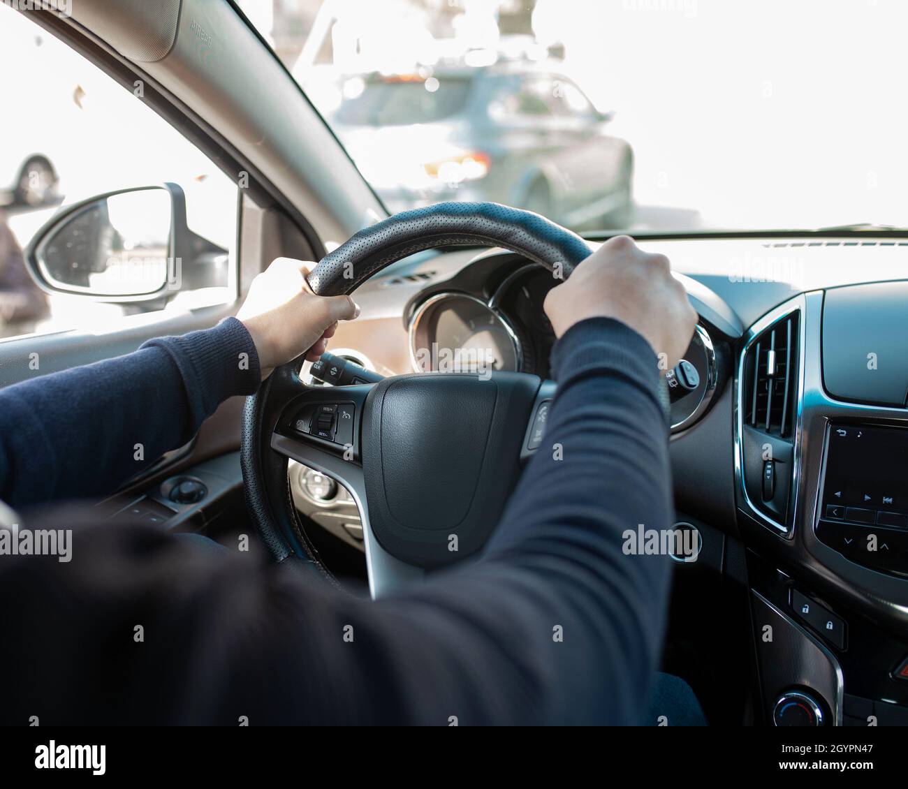 Mens hand on steering wheel hi-res stock photography and images - Alamy