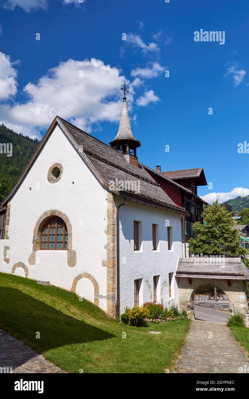 Side building of Saanen church, Gstaad region, Switzerland Stock Photo