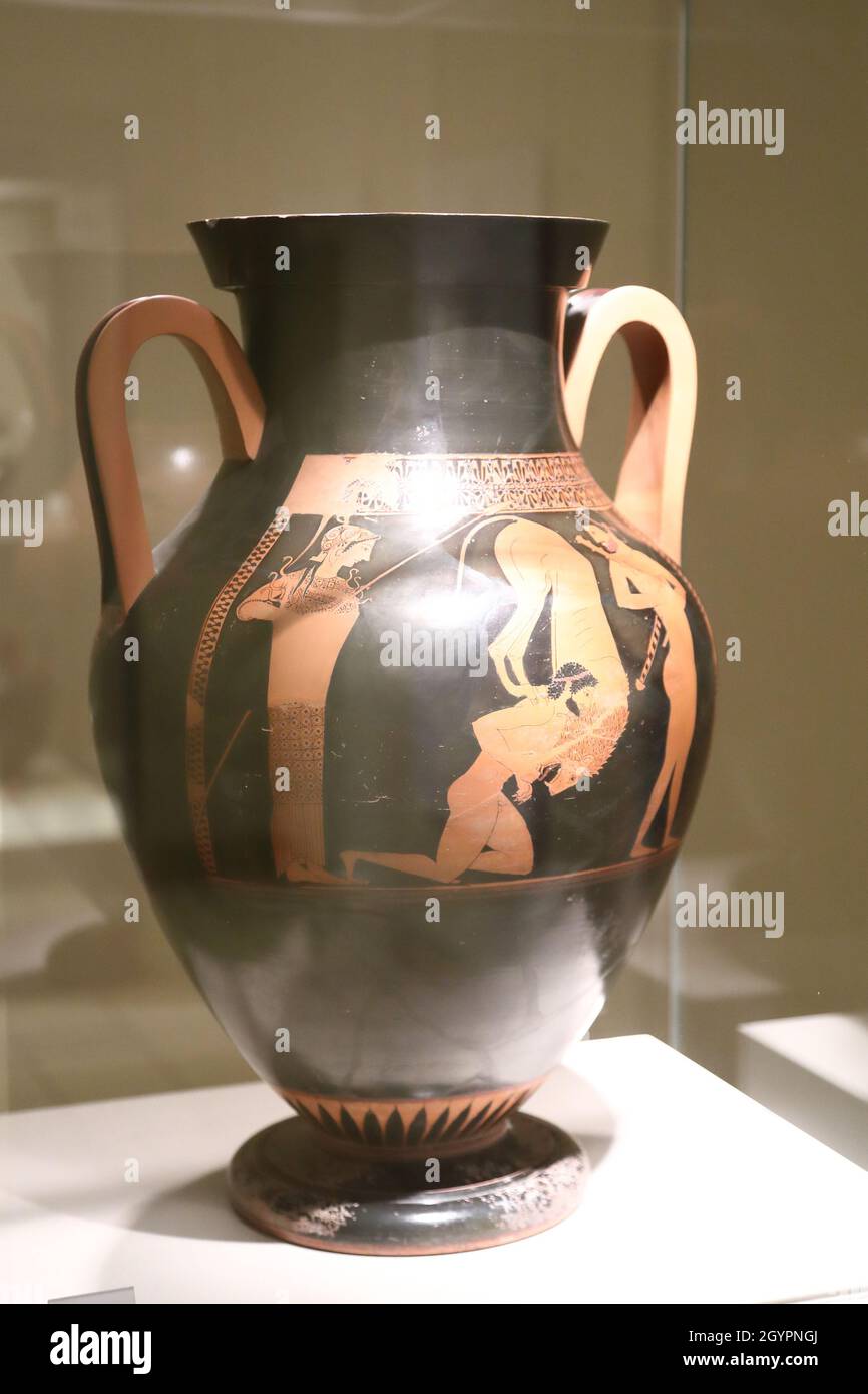 Greek amphora depicting Herakles fighting the Nemean lion at the British Museum, London, UK Stock Photo