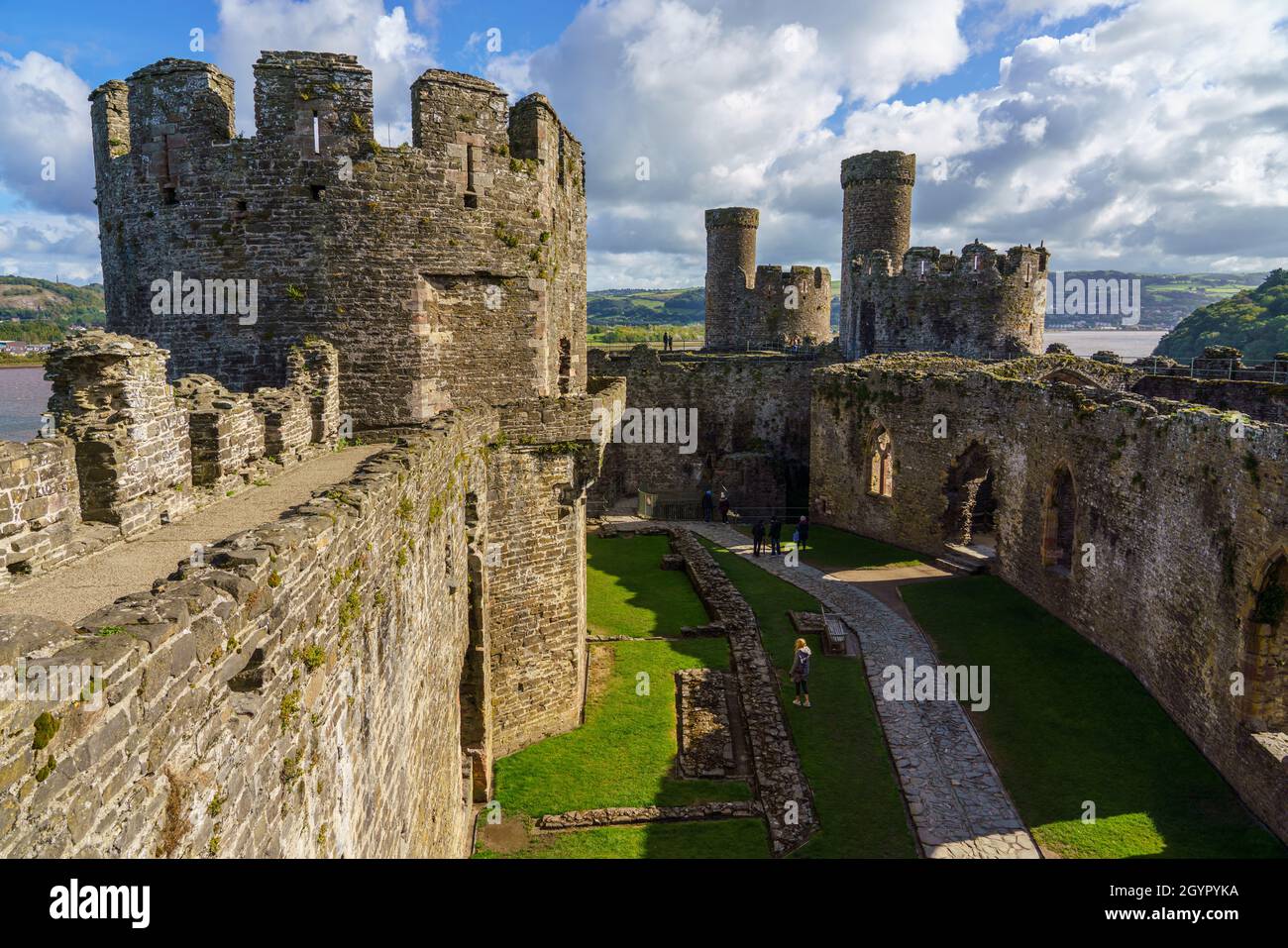 inside courtyard of the well preserved 13th century medieval Conwy castle, seen from the East side of the imposing fortress in North Wales Stock Photo