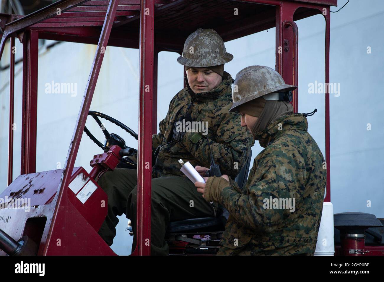 Marine Sgt. Justin Reeves, left, and Cpl. Jacob Nagele coordinate logistics in support of exercise Carolina Patriot 2020 in Philadelphia, Pennsylvania, Jan. 22, 2020. The exercise ensures 2nd Marine Aircraft Wing’s proficiency and readiness in aviation logistics support operations. Reeves is a mobile facility technician assigned to Marine Aviation Logistics Squadron (MALS) 31. Nagele is a mobile facility technician with MALS-41. (U.S. Marine Corps photo by Cpl. Cody Rowe) Stock Photo