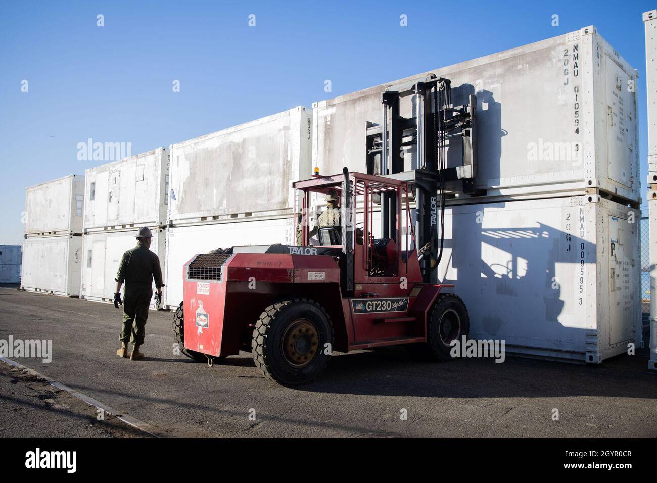 Marines prepare to load equipment aboard the aviation logistics support ...