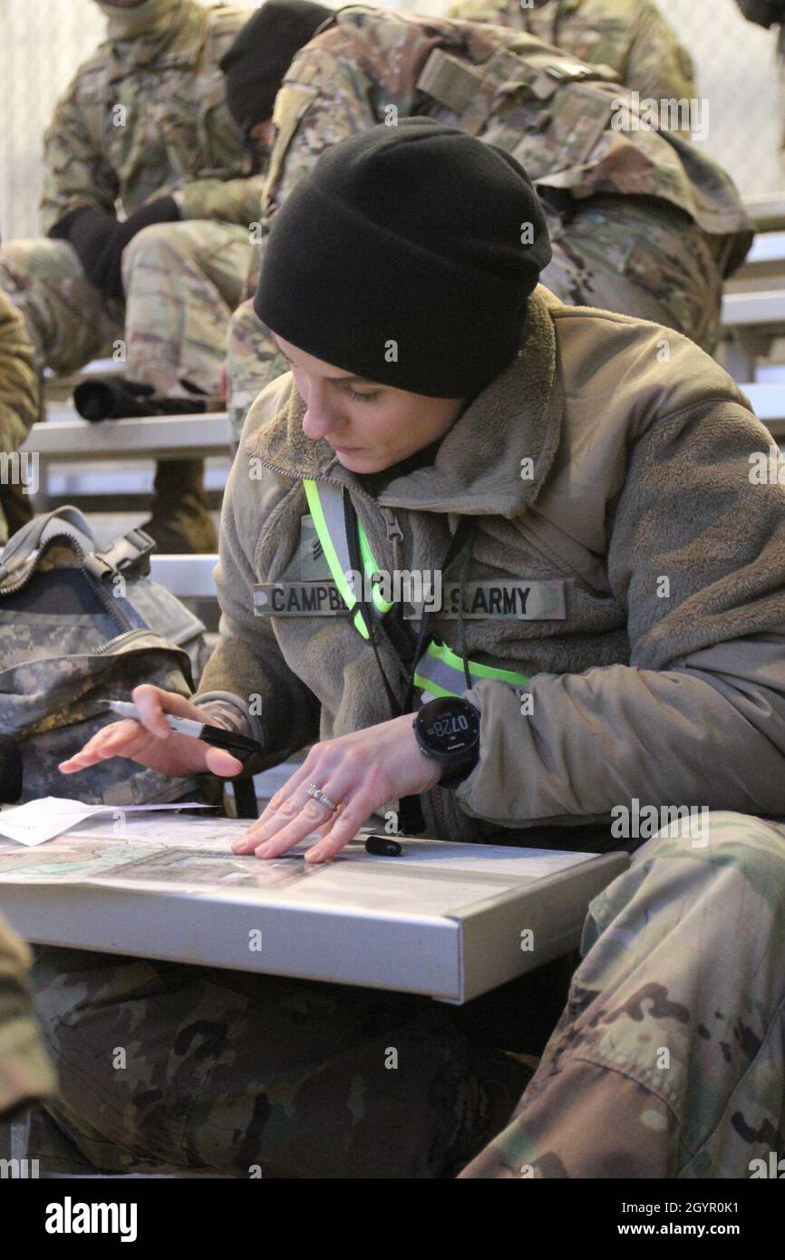 FORT GORDON, Ga. – Sgt. Megan Campbell, who hails from Indianapolis, Indiana, is a 35N, signals intelligence (SIGINT) analyst, representing A Company, 782nd Military Intelligence Battalion (Cyber), plots her points before heading out on the land navigation course on Range 6/7, January 22. Stock Photo