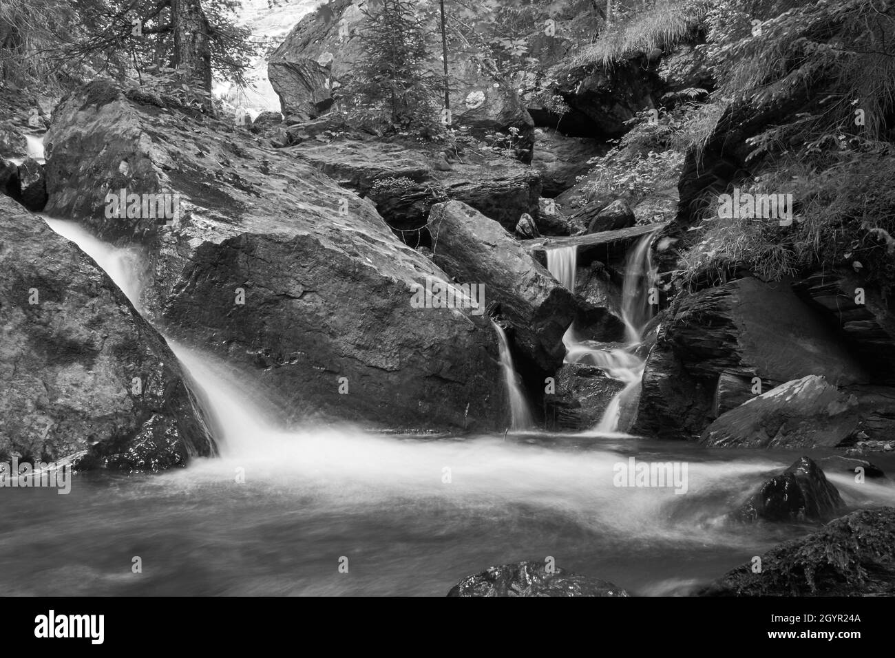 Black & white closeup of a fresh rocky Swiss mountain river Stock Photo