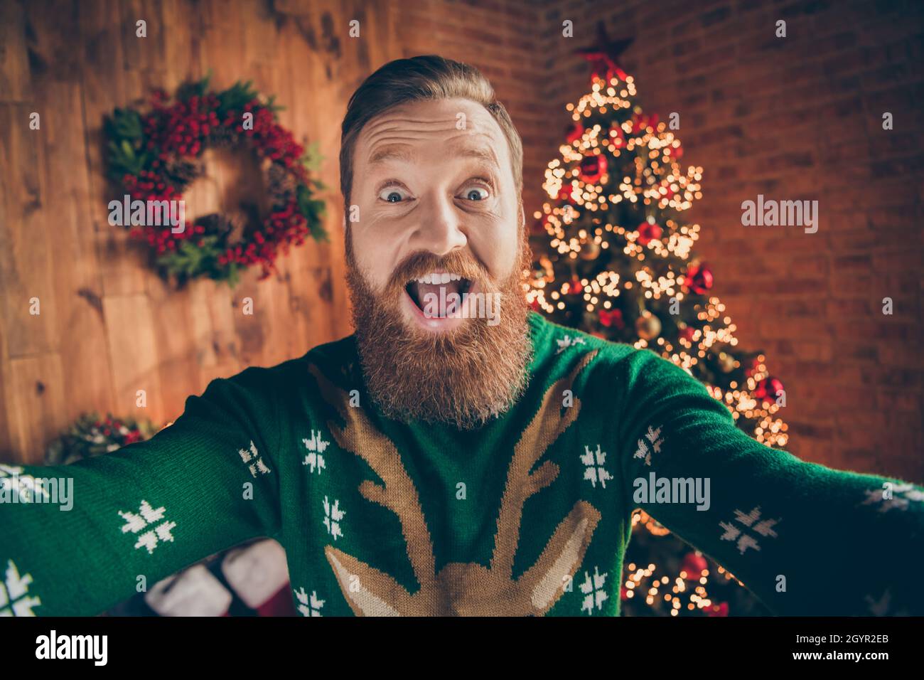 Photo of crazy amazed funny guy make selfie open mouth omg reaction wear deer pullover decorated