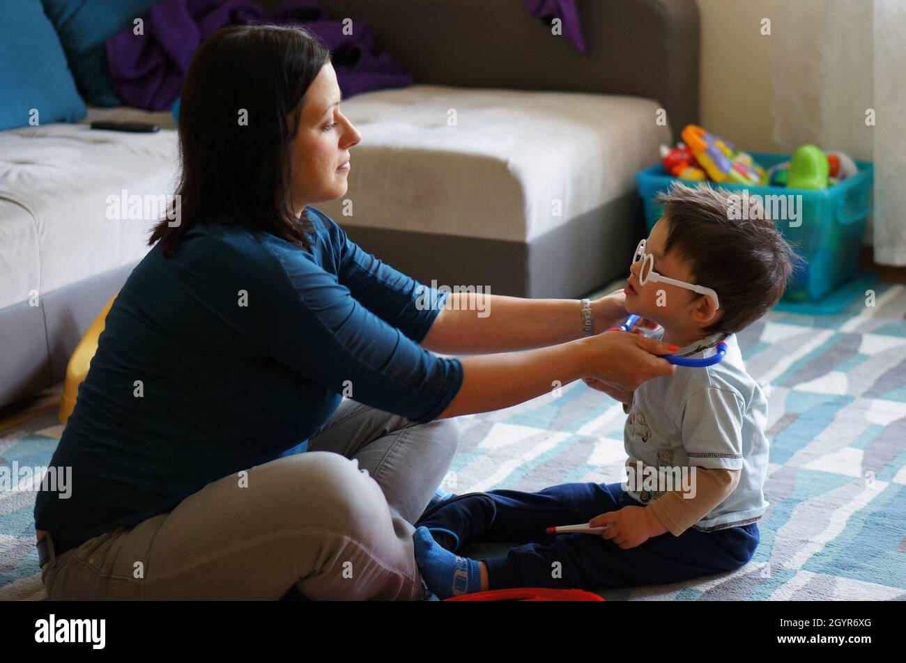 Mother with her beautiful kid from the netherlands playing doctors at