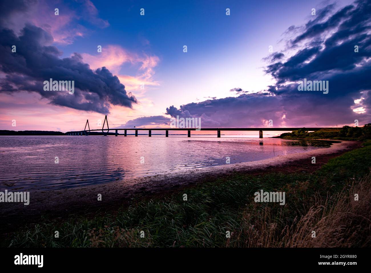 South Farø Bridge across the Storstrømmen sound after sunset. Stock Photo