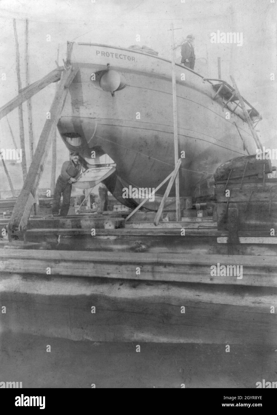 A vintage photo circa 1901 of the US submarine Protector designed by the engineer Simon Lake and built by the Lake Torpedo Boat Company in Bridgeport, Connecticut.  Protector was the first submarine to have diving planes mounted forward of the conning tower and a flat keel.  Protector was sold to Imperial Russia in 1904 and renamed Osetr Stock Photo