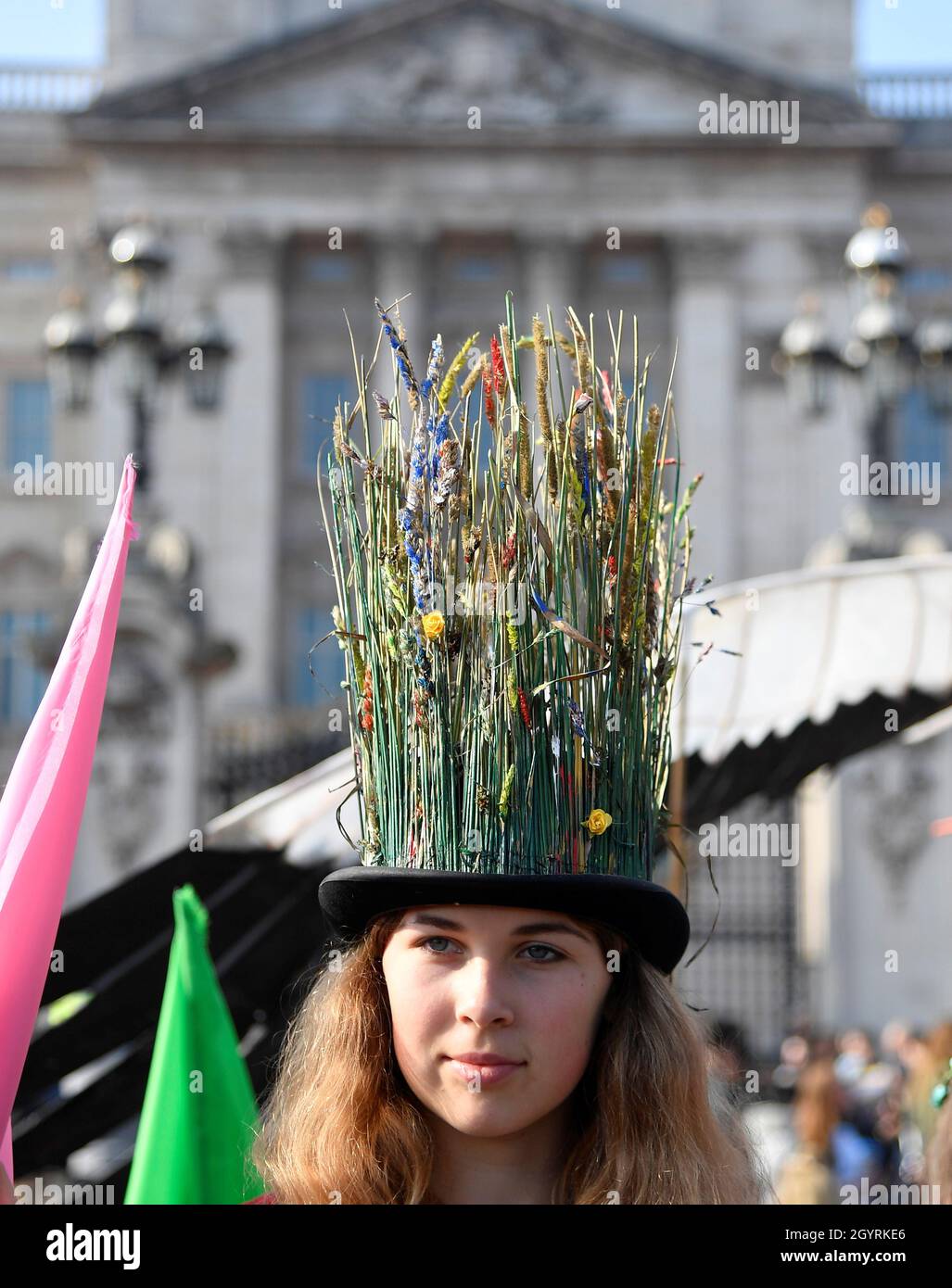 An environmental campaigner takes part in a march and delivery of a petition to Buckingham Palace, demanding that the British royal family rewild their land, ahead of the COP26 climate summit due to take place in November, in London, Britain, October 9, 2021. REUTERS/Toby Melville Stock Photo