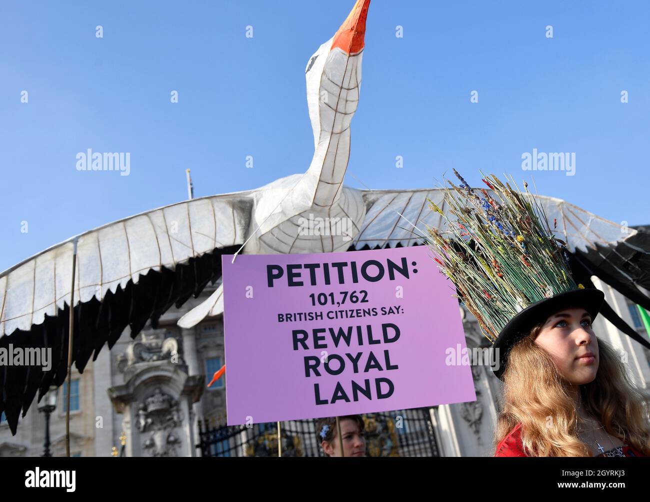 An environmental campaigner takes part in a march and delivery of a petition to the Buckingham Palace, demanding that the British royal family rewild their land, ahead of the COP26 climate summit due to take place in November, in London, Britain, October 9, 2021. REUTERS/Toby Melville Stock Photo