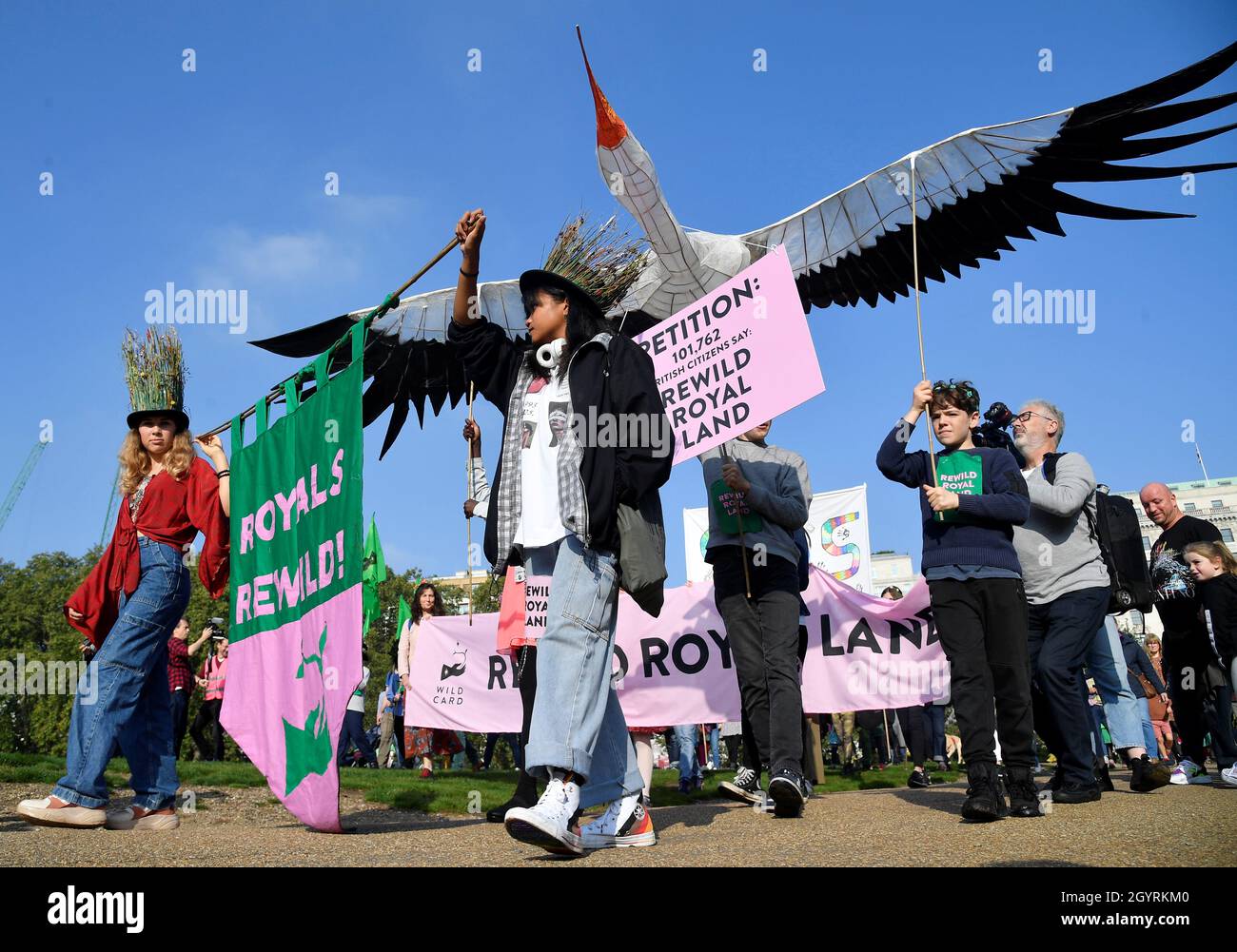 Environmental campaigners part in a march and delivery of a petition to the Buckingham Palace, demanding that the British royal family rewild their land, ahead of the COP26 climate summit due to take place in November, in London, Britain, October 9, 2021. REUTERS/Toby Melville Stock Photo