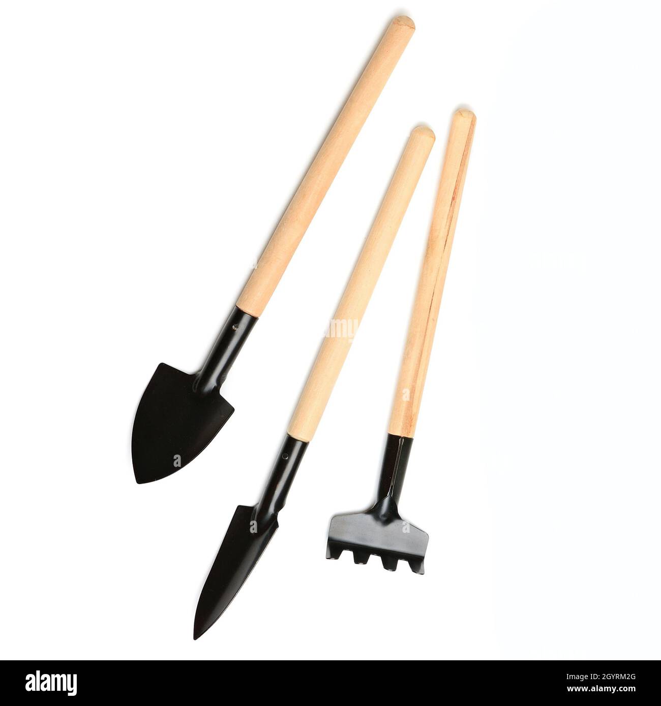 Set of miniature gardening tools isolated on white background Stock