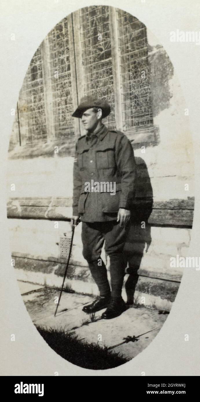 A First World War era portrait of an Australian soldier, a Corporal in the First Australian Imperial Force, standing outside what appears to be a church. Stock Photo