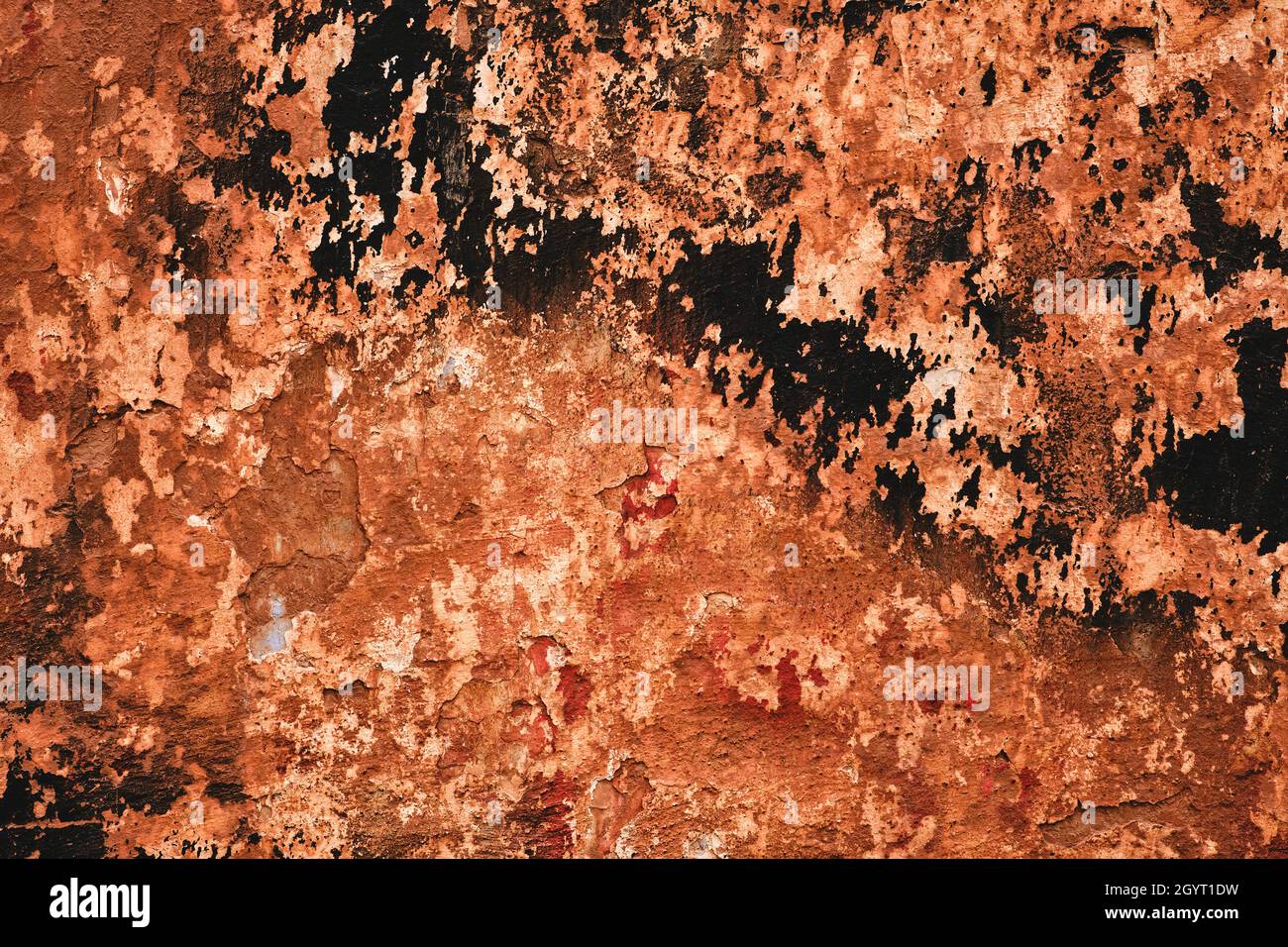 Old ruin wall with peeling paint, grunge background or texture Stock