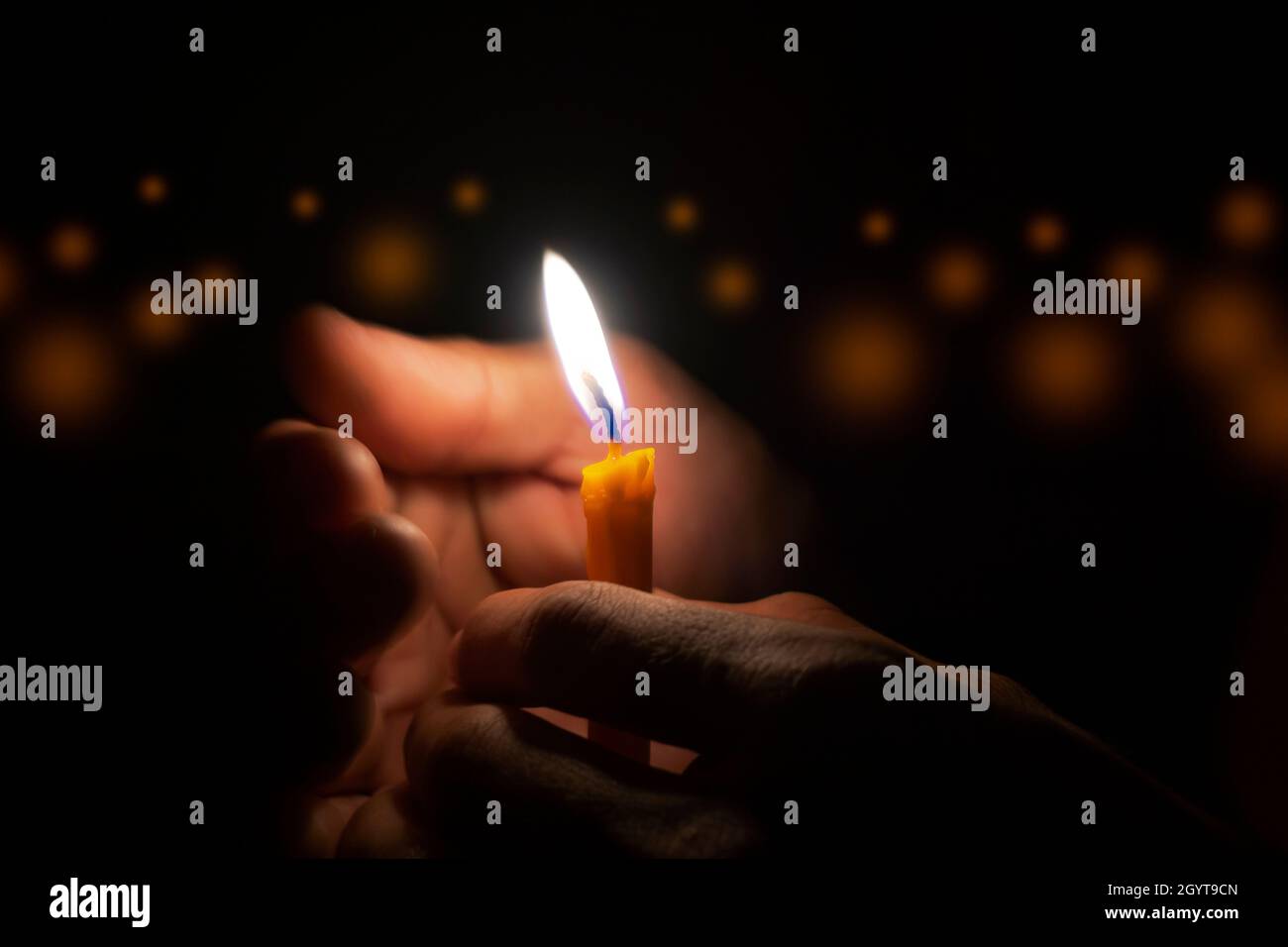 Man Holding Burning Match While Lighting Candles In Dark Kitchen During Power  Outage Stock Photo, Picture and Royalty Free Image. Image 194083174.