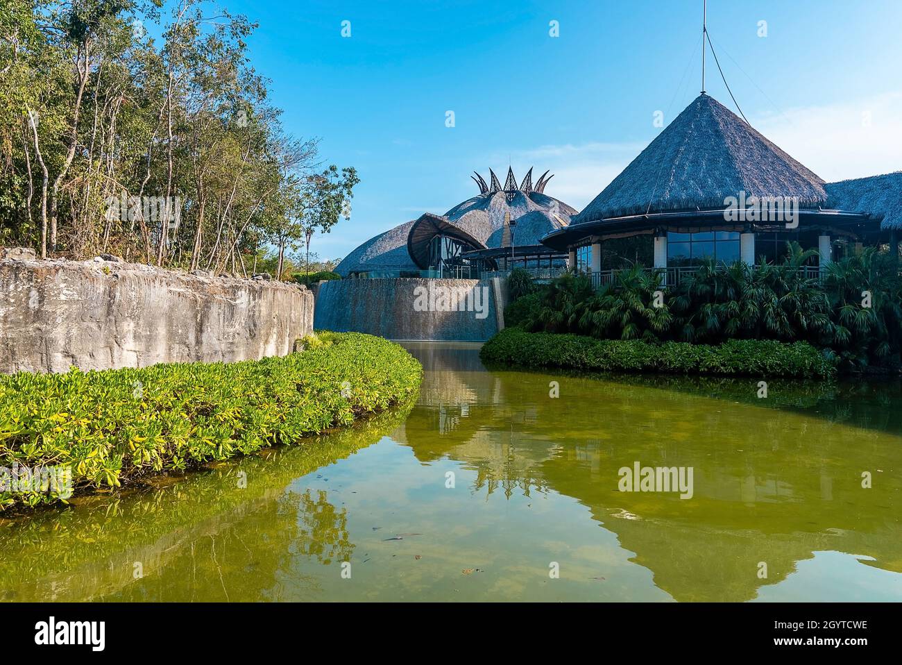 View of eco friendly resort covered with forest and lake Stock Photo ...