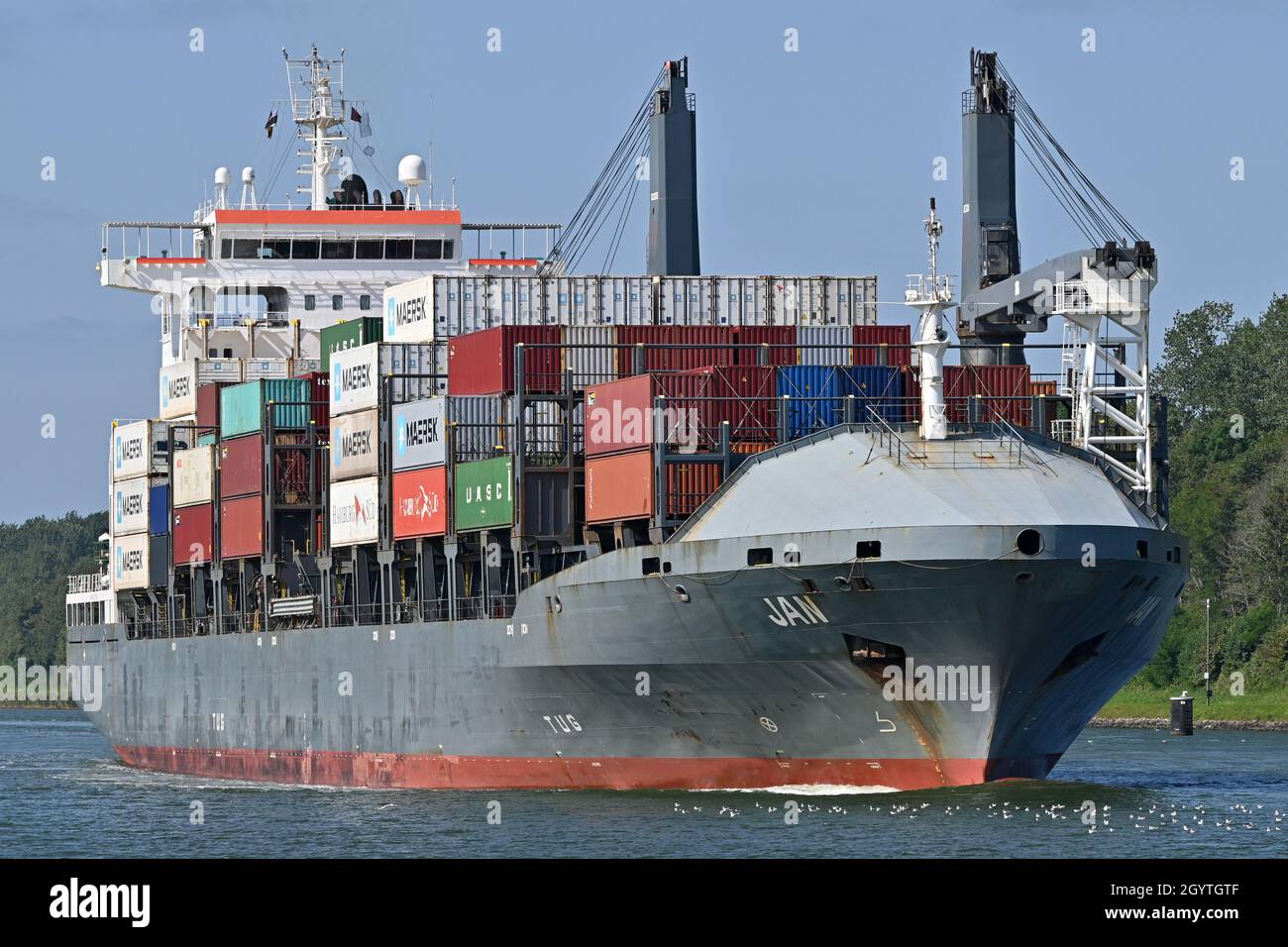 Containership JAN passing the Kiel Canal Stock Photo