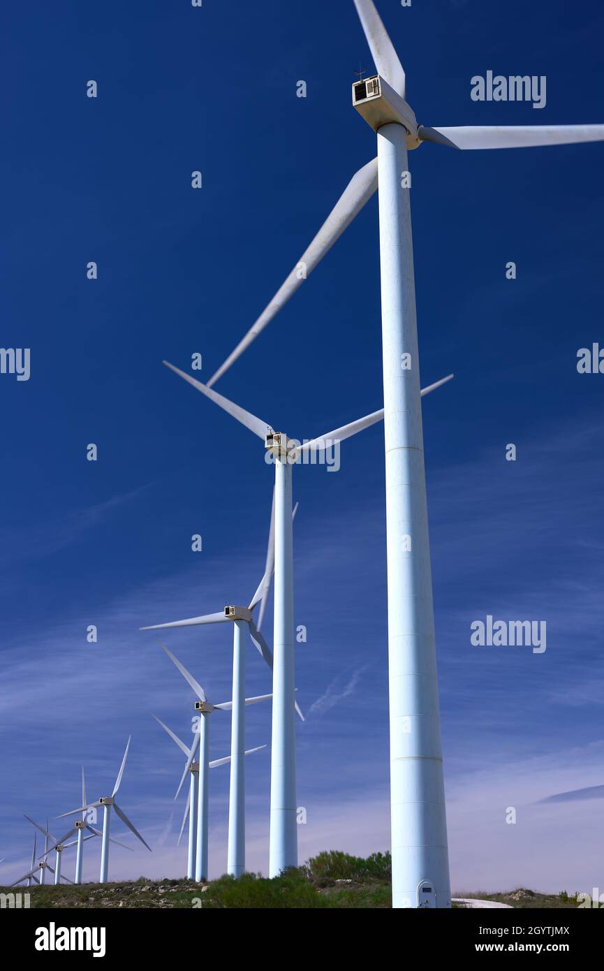 detail of a modern windmill farm with blue skies Stock Photo - Alamy