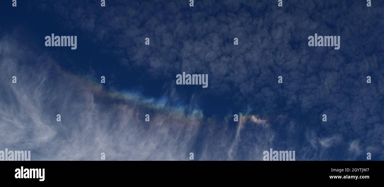 Close up of fire rainbow within Cirrus cloud. Stock Photo