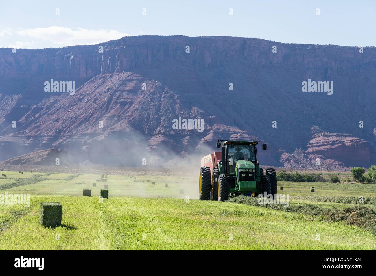 Baling hay with a John Deere 7930 tractor and a GPT Twin Pak baler on a