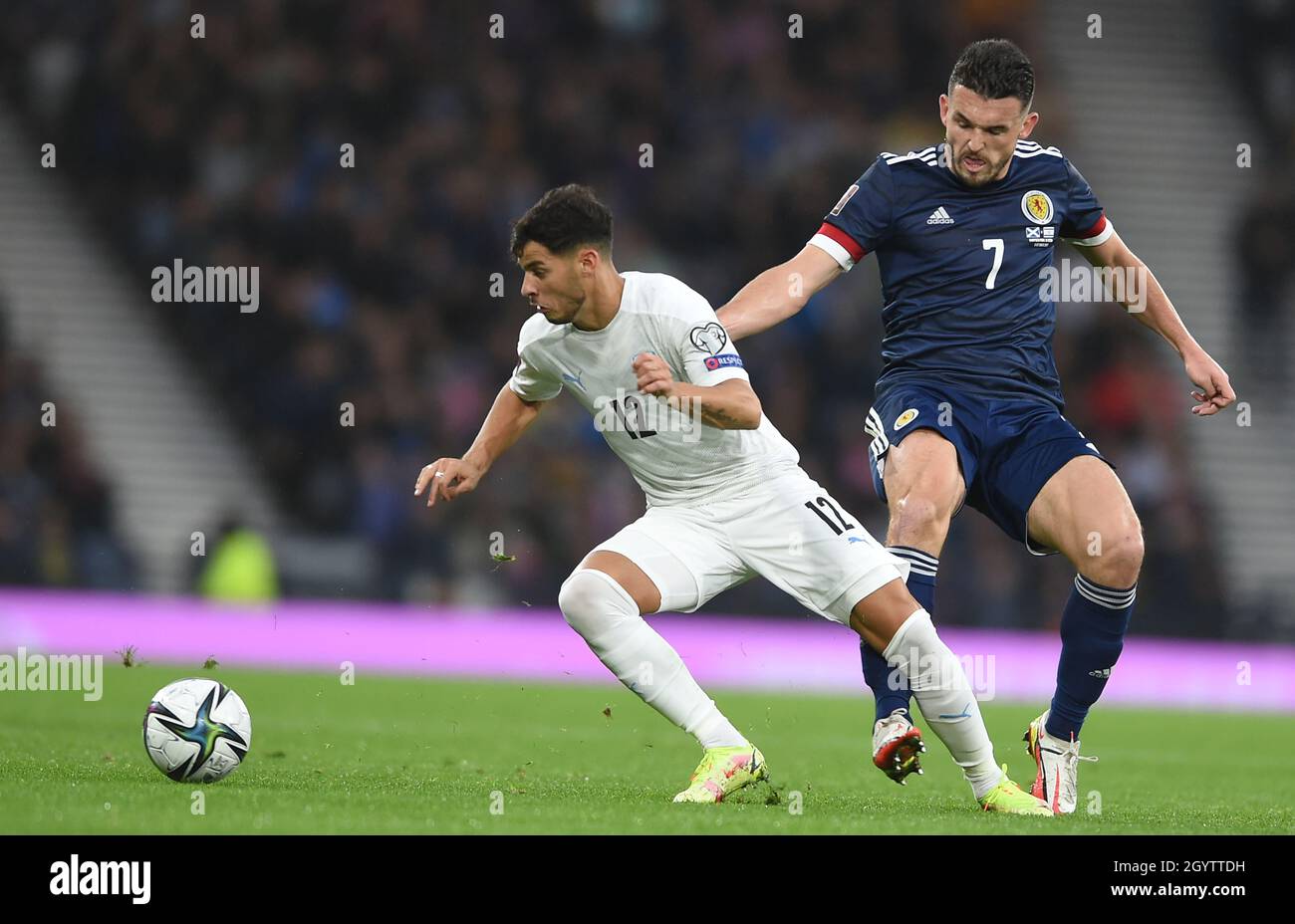 Glasgow, Scotland, 9th October 2021. Sun Menachem of Israel and John McGinn of Scotland  during the FIFA World Cup qualifiers match at Hampden Park, Glasgow. Picture credit should read: Neil Hanna / Sportimage Stock Photo