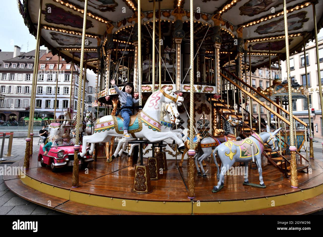 The old 1900s carousel Johannes Gutenberg square in Strasbourg, France Stock Photo
