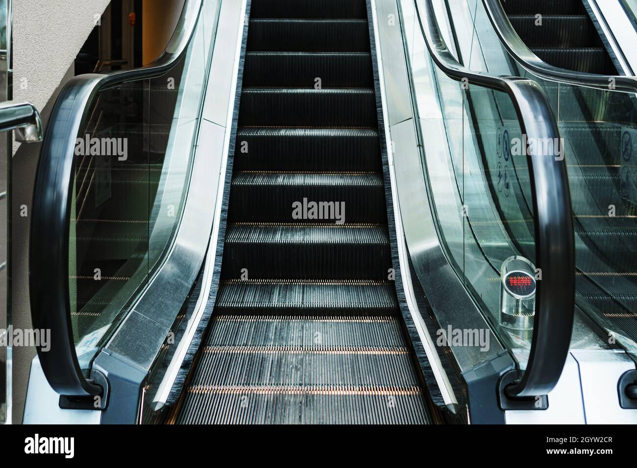 Escalator lifting steps in the waiting rooms of the station. Climbing ...