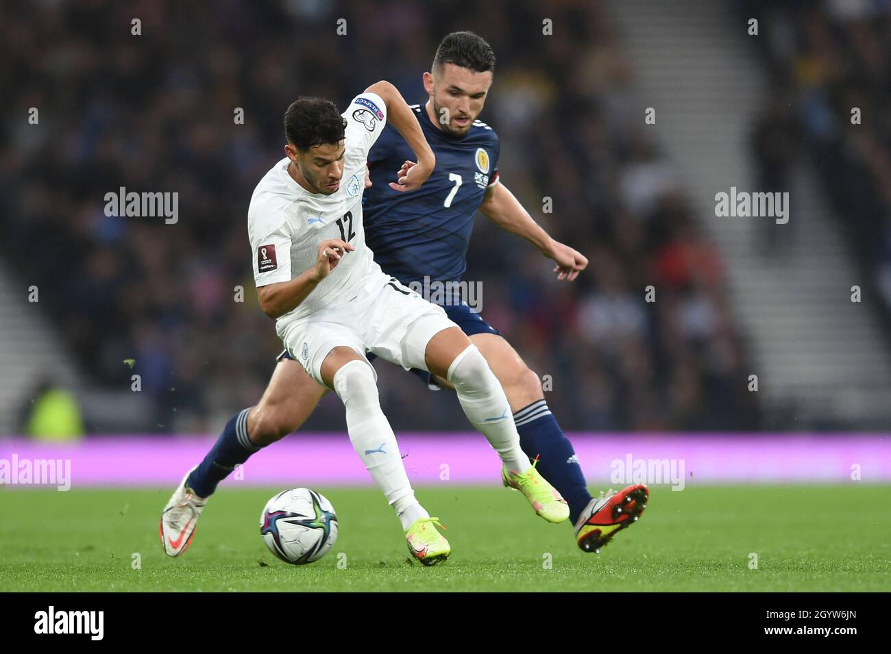 Glasgow, Scotland, 9th October 2021. Sun Menachem of Israel and John McGinn of Scotland   during the FIFA World Cup qualifiers match at Hampden Park, Glasgow. Picture credit should read: Neil Hanna / Sportimage Stock Photo