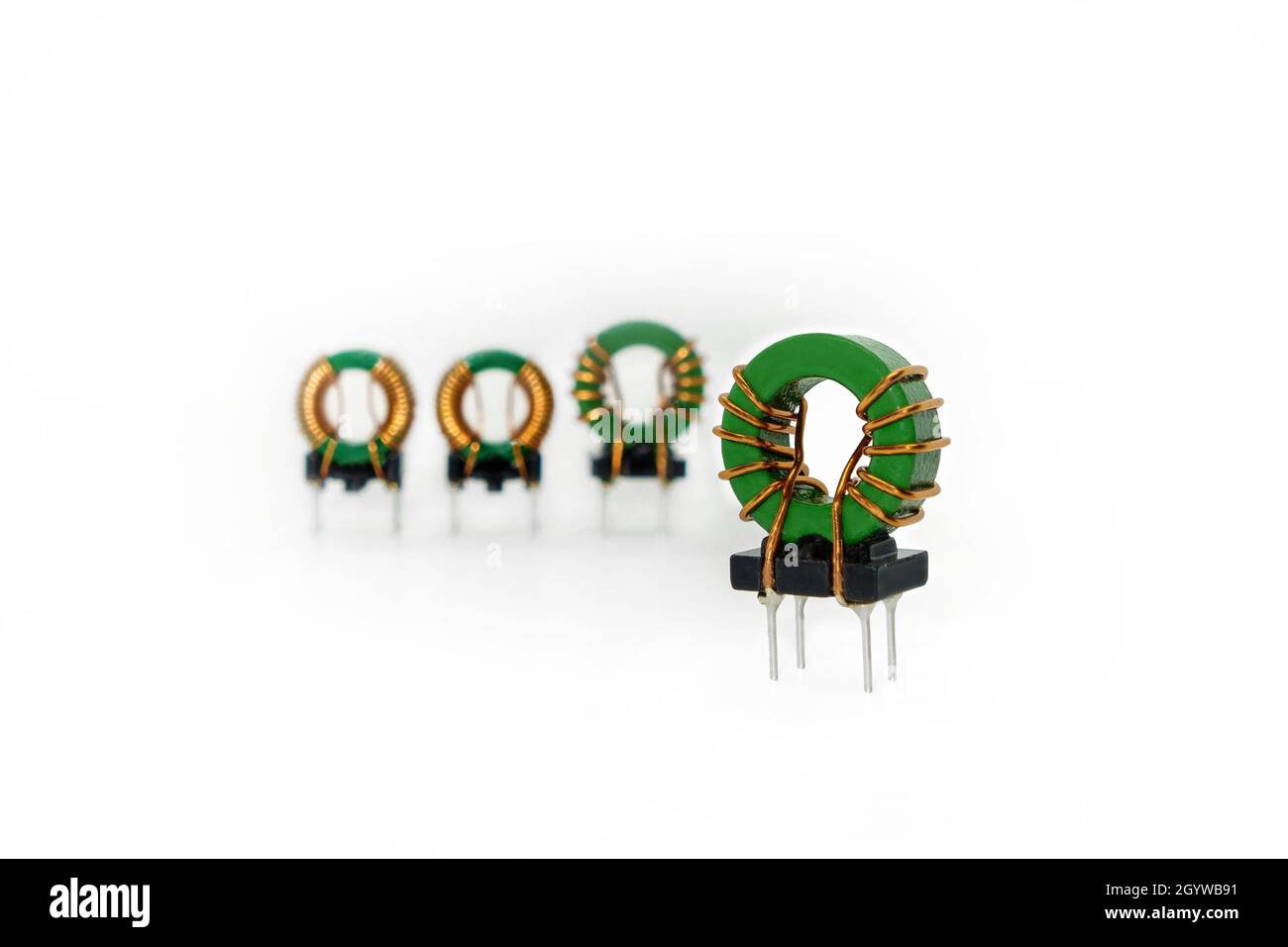 Close up view onto round core inductor, group of others are on blurred background Stock Photo