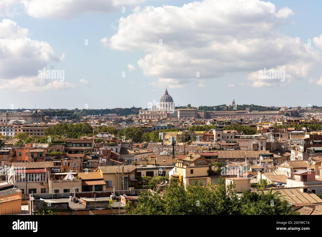 Roman roofs and dome of St. Peter's Basilica in distance, viewed from Pincian Hill in Rome, Italy Stock Photo