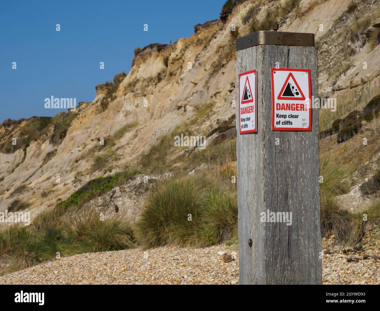 Danger sign of cliff collapse at Hengistbury Head, Dorset, UK Stock Photo