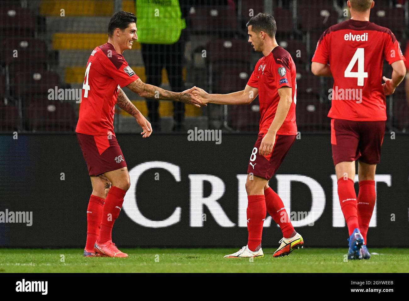 Switzerland’s Steven Zuber celebrates scoring their side's first goal of the game with team-mates during the FIFA World Cup Qualifying match at Stade de Geneve, Switzerland. Picture date: Saturday October 9, 2021. Stock Photo