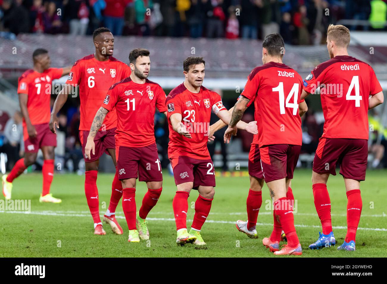 Switzerland’s Steven Zuber celebrates scoring their side's first goal of the game with team-mates during the FIFA World Cup Qualifying match at Stade de Geneve, Switzerland. Picture date: Saturday October 9, 2021. Stock Photo