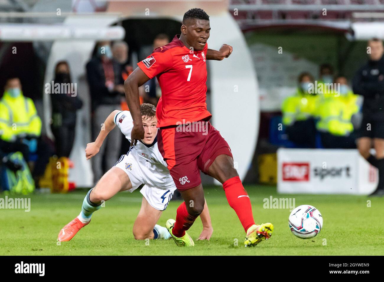Northern Ireland’s Daniel Ballard and Switzerland’s Breel Embolo during the FIFA World Cup Qualifying match at Stade de Geneve, Switzerland. Picture date: Saturday October 9, 2021. Stock Photo