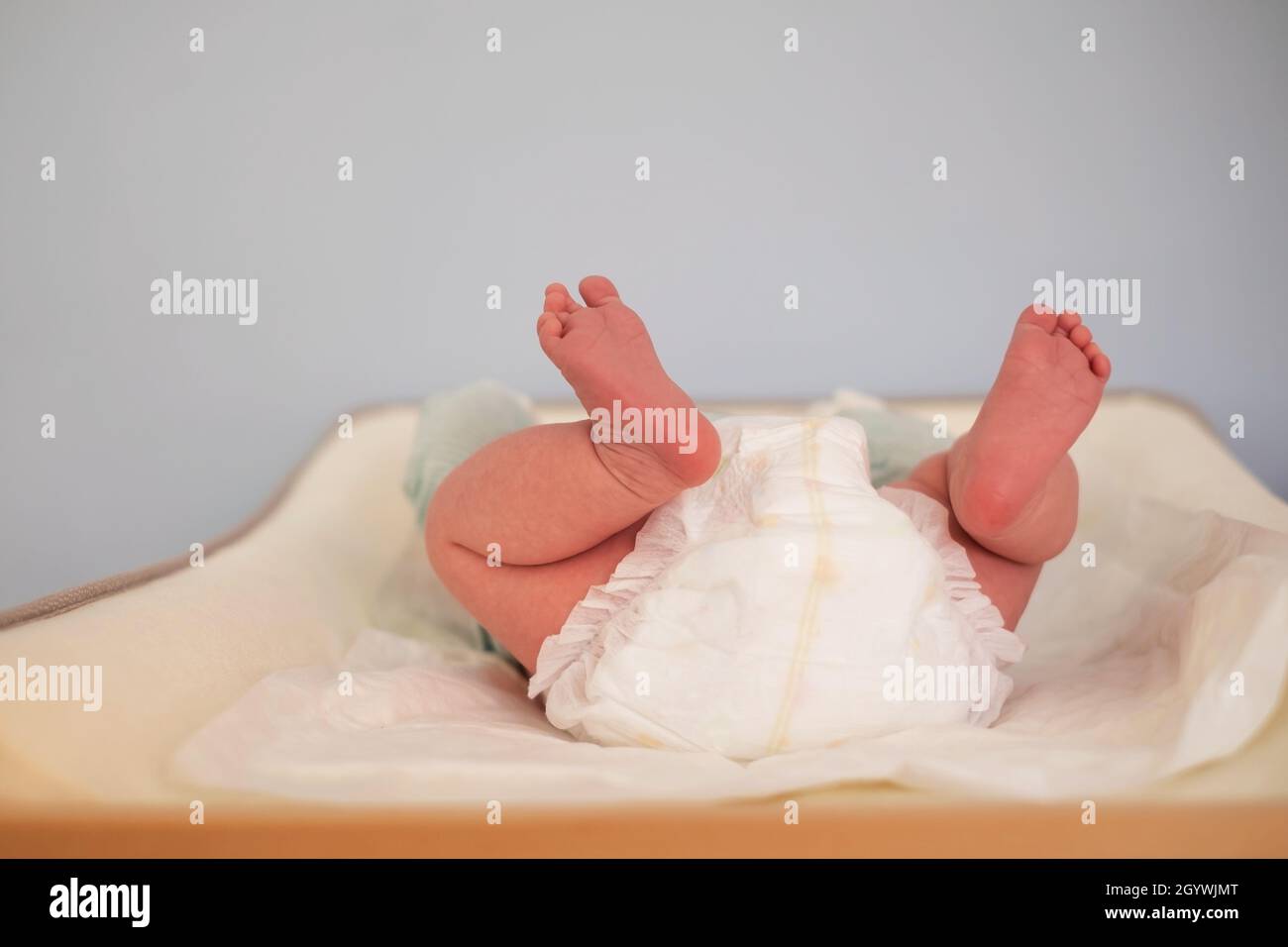 Baby on changing table staying alone without control Stock Photo Alamy