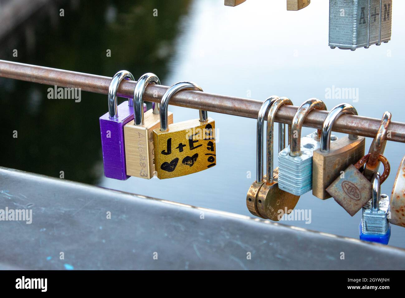 'Love locks': Locks with messages of love hanging from a bridge railing Stock Photo