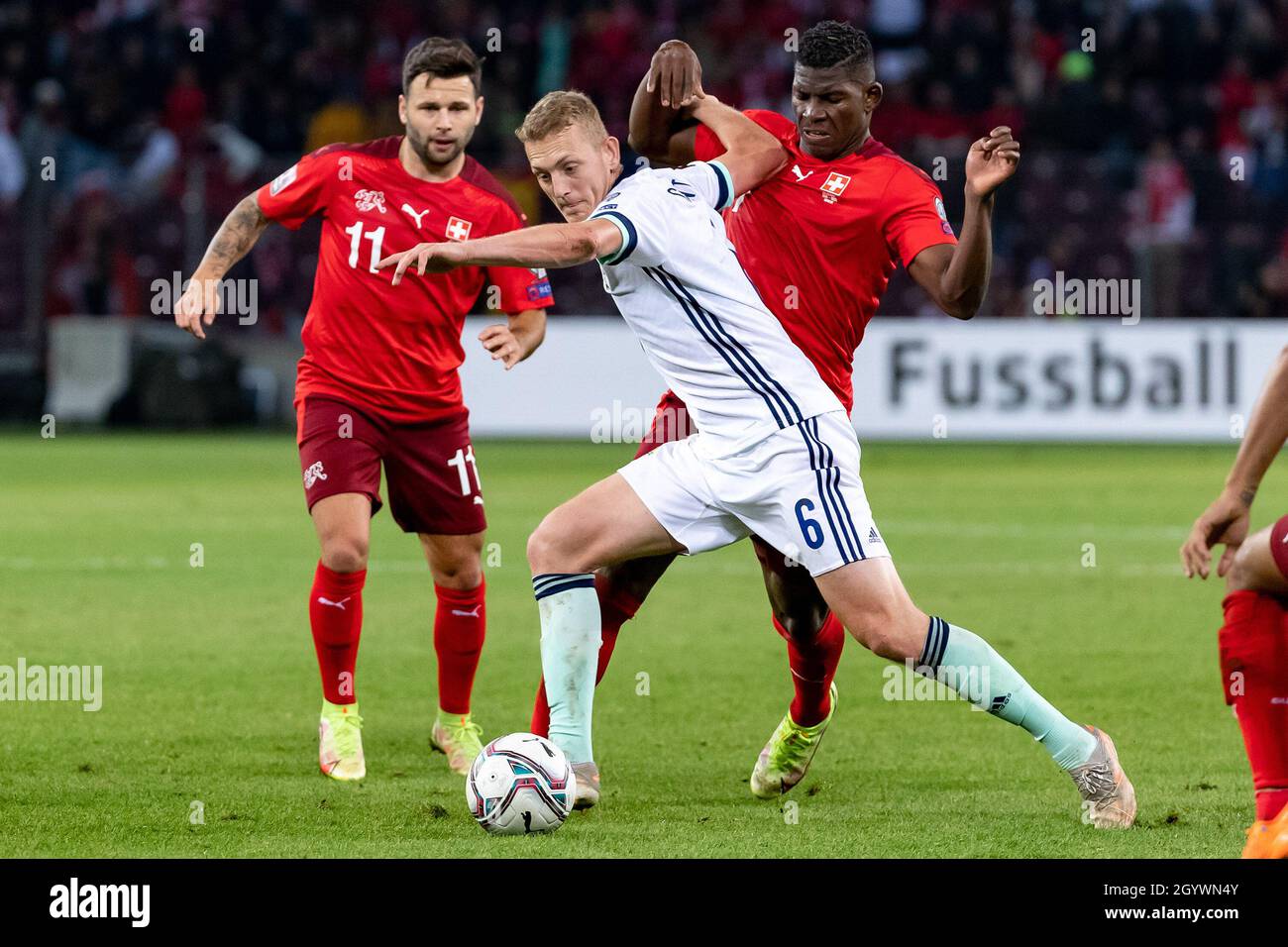 Switzerland’s Renato Steffen, Breel Embolo and Northern Ireland’s George Saville during the FIFA World Cup Qualifying match at Stade de Geneve, Switzerland. Picture date: Saturday October 9, 2021. Stock Photo