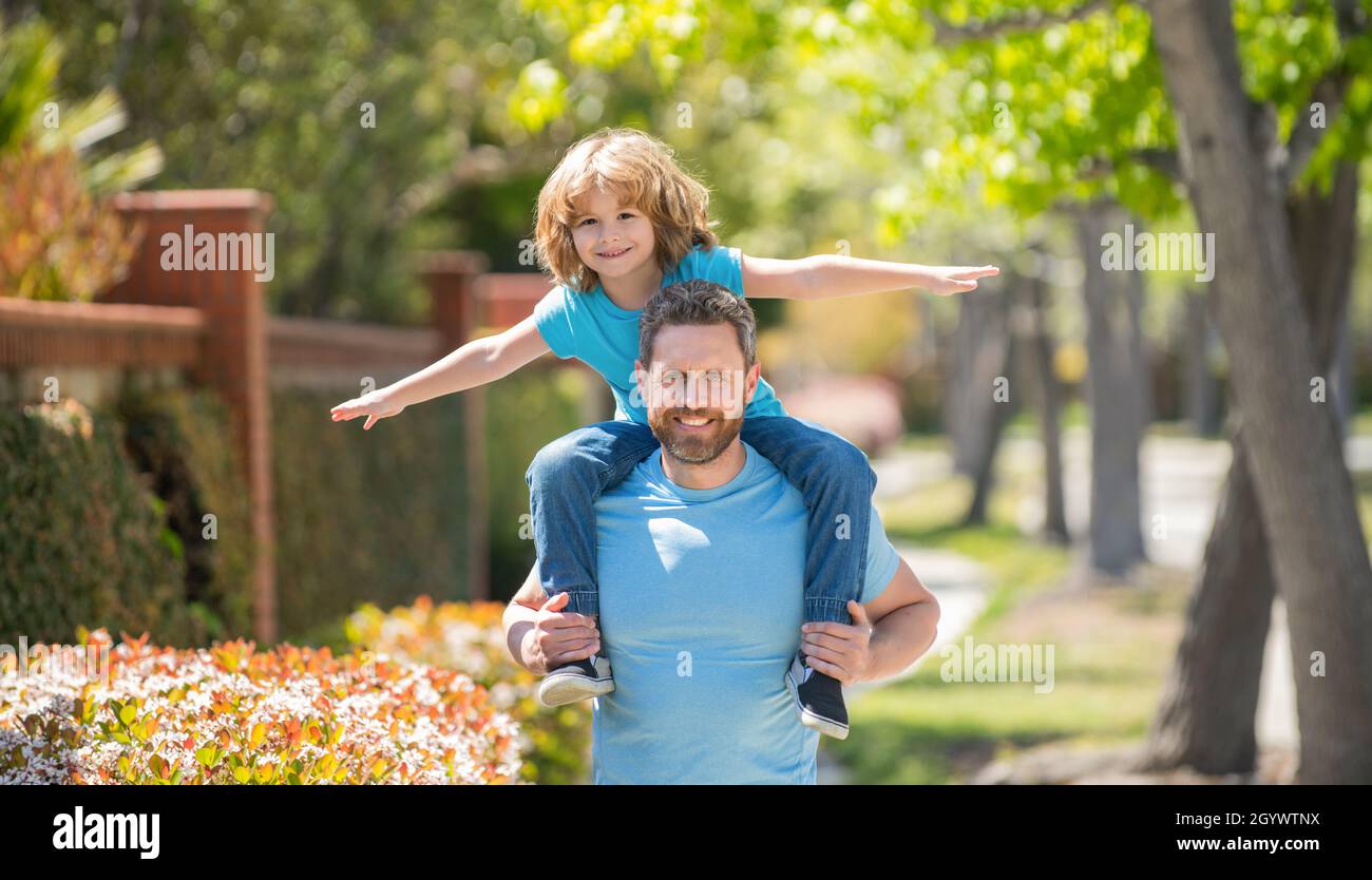 cheerful father and son have fun in park. family value. childhood and parenthood. Stock Photo