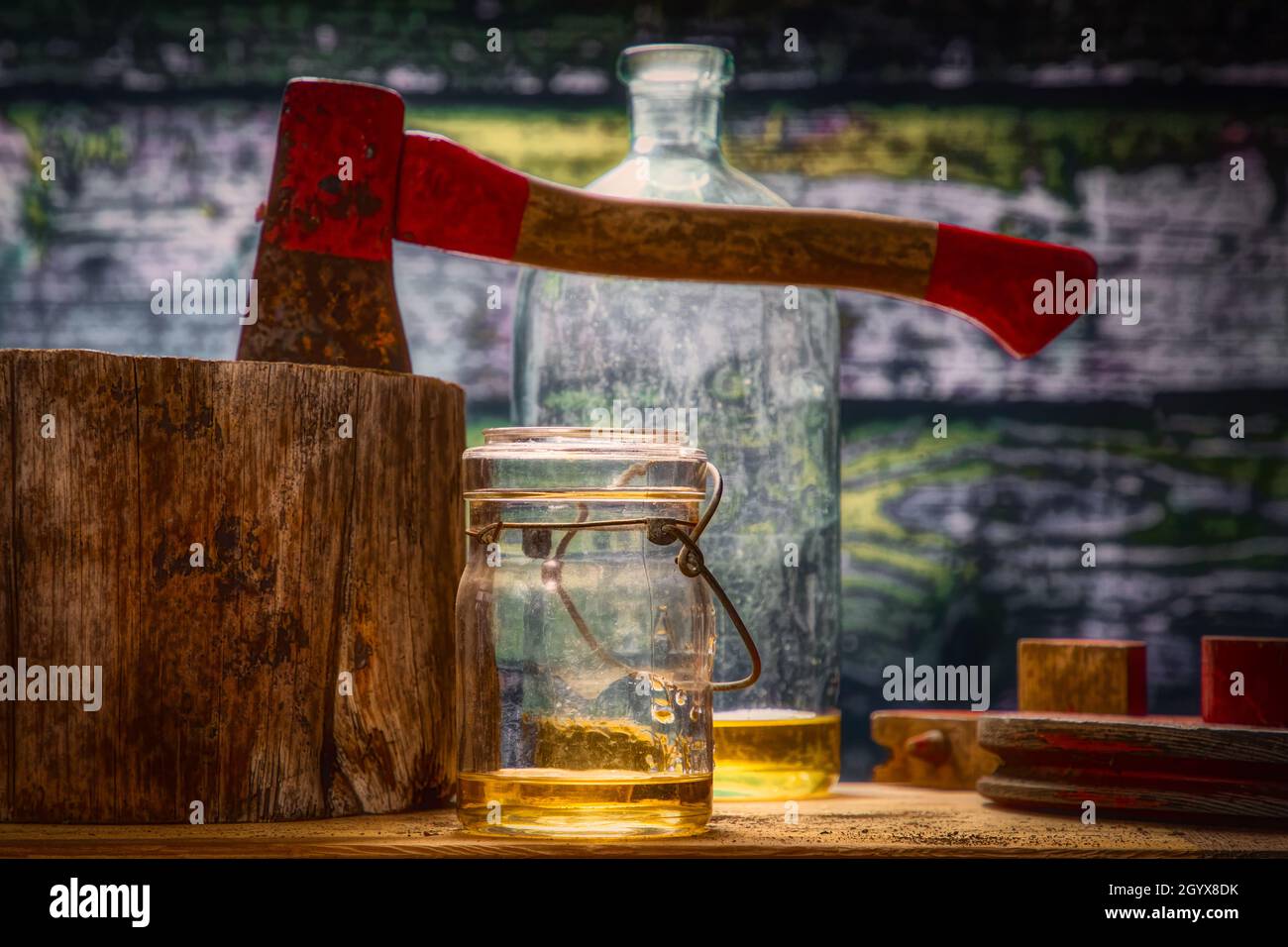Old Hatchet in a Chopping Block Hightlight on Bourbon Whiskey Glass