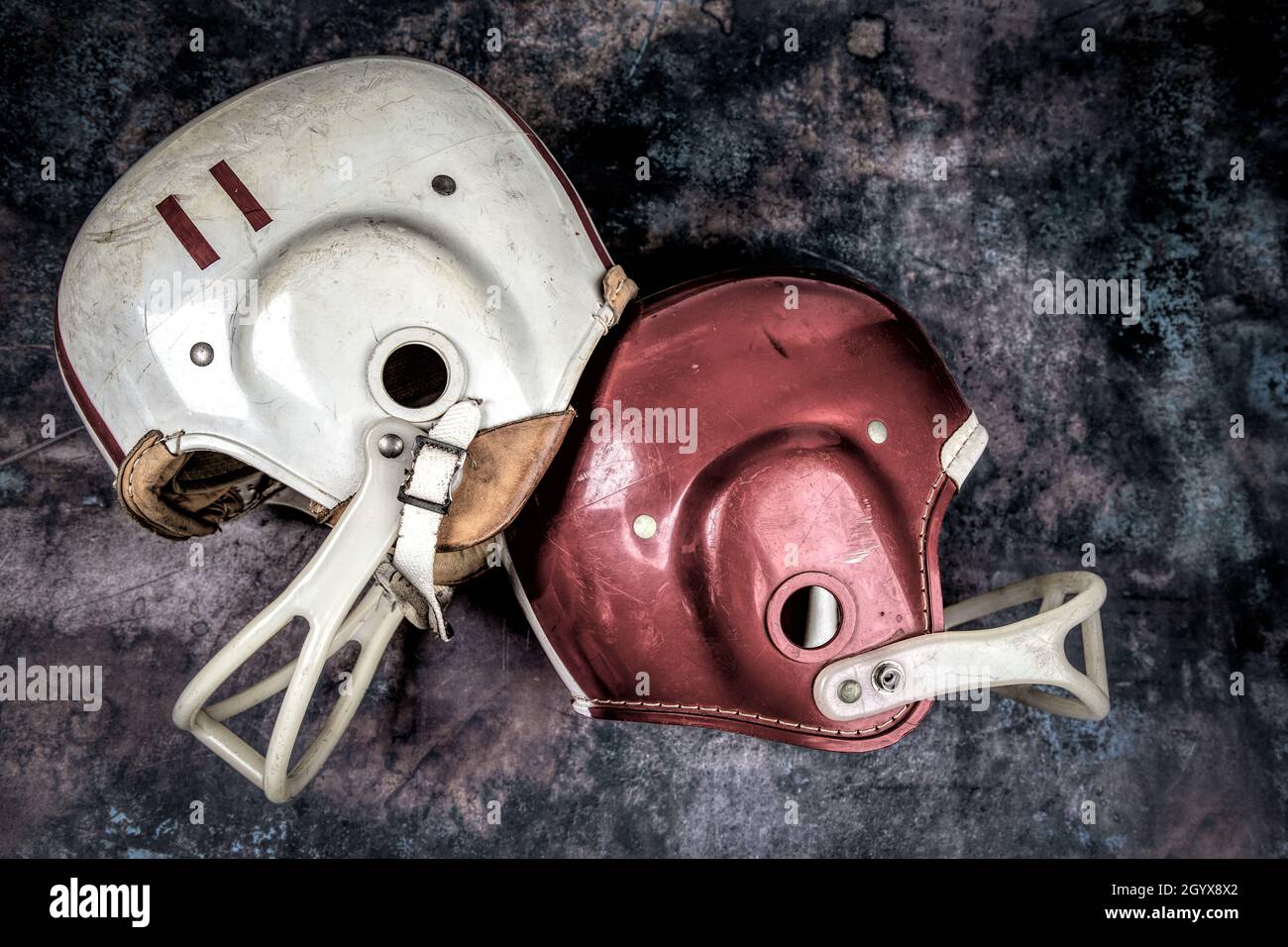 Vintage Boys Football Helmets and Leather Shoulder Pads Stock Photo Alamy